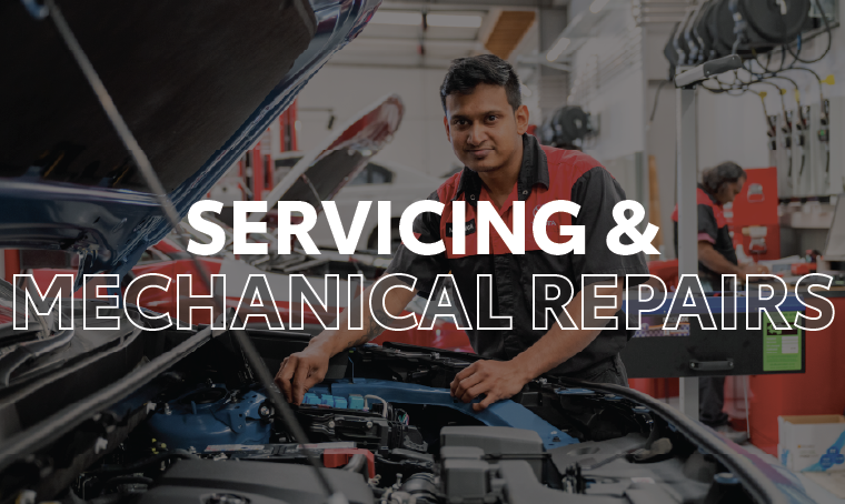 An auto mechanic working in the engine bay of a Toyota with overlay text that reads, "servicing and mechanical repairs"