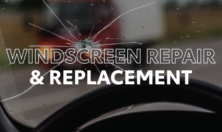 A broken windscreen with overlay text that reads, "windscreen repair and replacement"
