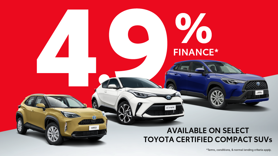 Promotional banner with a bold red background featuring large white text that reads ‘4.9% FINANCE’. Below, three Toyota certified compact SUVs are displayed: a gold Toyota Yaris Cross on the left, a white Toyota C-HR in the center, and a blue Toyota Corolla Cross on the right. Smaller black text at the bottom says ‘AVAILABLE ON SELECT TOYOTA CERTIFIED COMPACT SUVs’. Fine print reads ‘Terms, conditions, & normal lending criteria apply.